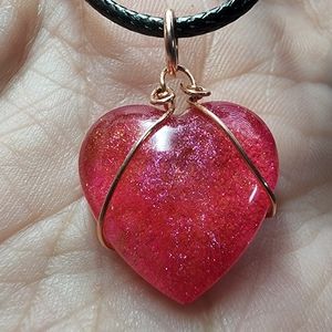 NWOT handcrafted resin heart neclace wrapped in copper, black neck cord included